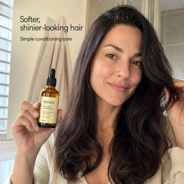 Woman holding 60 ml hair and scalp conditioning oil with soft shiny hair