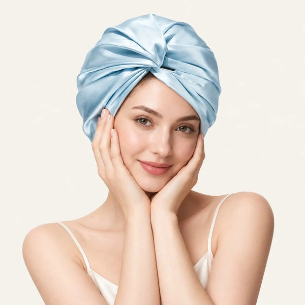 Woman wearing a light blue 19 momme mulberry silk bonnet