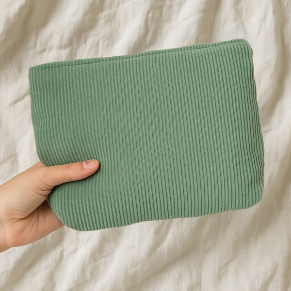 Corduroy travel pouch for beauty accessories.