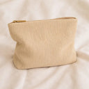 Beige toiletry bag for hair accessories and heatless curlers