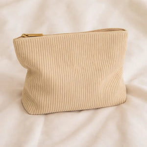 Beige toiletry bag for hair accessories and heatless curlers