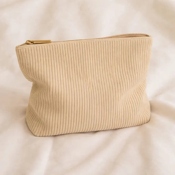 Beige toiletry bag for hair accessories and heatless curlers