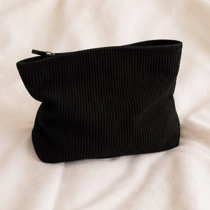 Black toiletry bag for hair accessories and heatless curlers