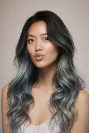 Woman with dark hair and soft voluminous waves
