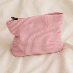 Pink toiletry bag for hair accessories and heatless curlers