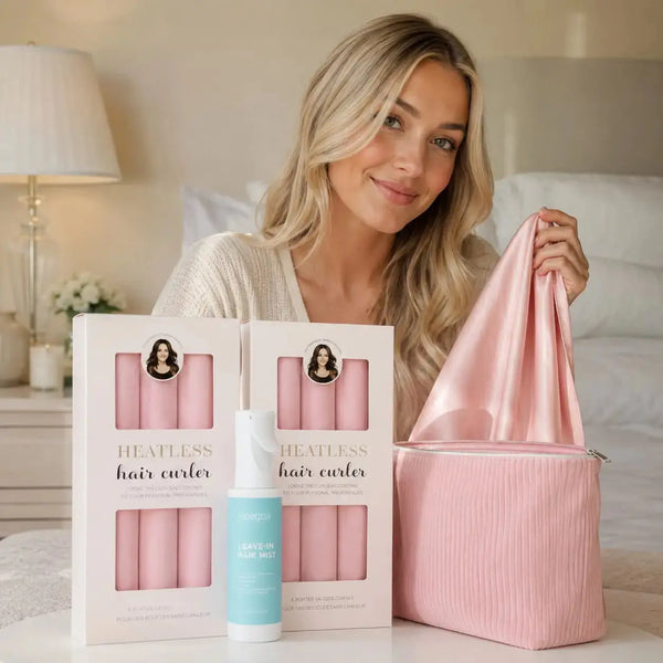 Young blonde woman with long hair presenting the Revitalysse Long Hair Curl Essentials Pink Set with heatless curlers, hair mist, satin scarf and storage pouch