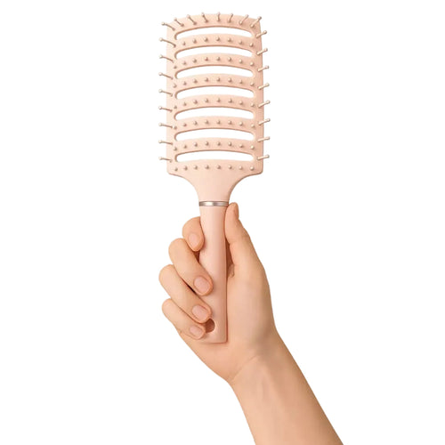 Pink anti static brush held in hand for easy hair styling