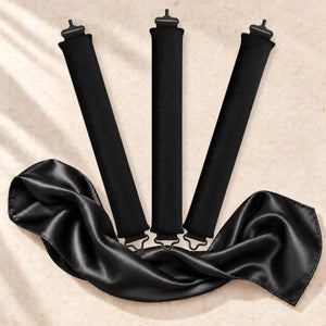 Revitalysse black velvet heatless curling rollers with matching black satin scarf, designed to create soft overnight curls without heat.