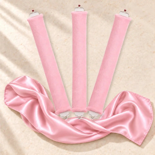 Revitalysse pink velvet heatless curling rollers with matching pink satin scarf, designed to create soft, natural overnight curls without heat.